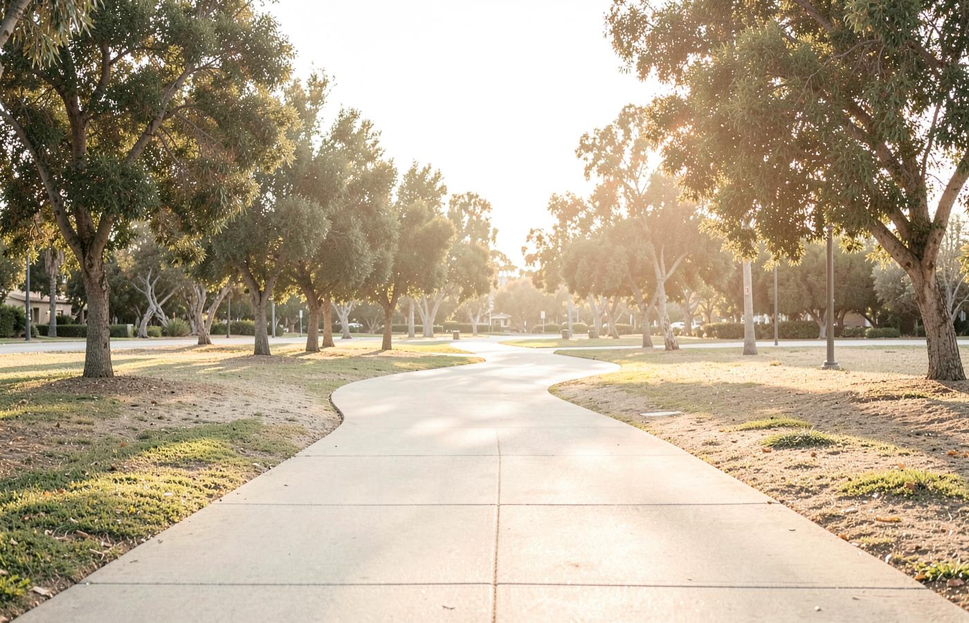 A community pathway in warm light, representing movement toward stability.